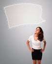 Attractive woman looking abstract speech bubble copy space