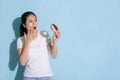 Attractive woman looking at donut sugar food