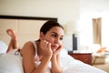 Attractive woman lying in bed looking sad Royalty Free Stock Photo