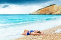 Attractive woman lying on famous beach Porto Katsiki on the Ionian island of Lefkas Greece Royalty Free Stock Photo