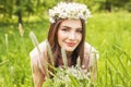 Attractive woman lying on meadow of green grass and flowers Royalty Free Stock Photo