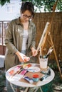 Attractive woman making palette and preparing for painting Royalty Free Stock Photo