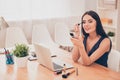 Attractive woman in office having break and doing maquillage Royalty Free Stock Photo