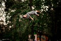 Attractive woman perfectly jumps and performs trick upside down in the air Royalty Free Stock Photo