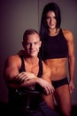 Attractive woman and a personal trainer with weight training Royalty Free Stock Photo