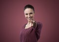 Attractive woman pointing forward Royalty Free Stock Photo