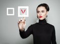 Attractive woman pointing her finger at red checkmark Royalty Free Stock Photo