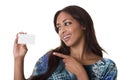 Attractive woman points to a blank business card. Royalty Free Stock Photo