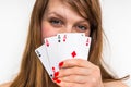 Attractive woman with poker cards isolated on white