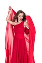 attractive woman posing in red dress with chiffon veil Royalty Free Stock Photo