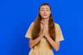 Attractive woman praying, looking upward, making wish, begging apology, asking help, forgive me Royalty Free Stock Photo