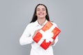 Attractive woman with present box posing with surprised face expression on gray background. Girl holding gift decorated Royalty Free Stock Photo