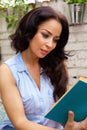 Attractive woman reading book outside Royalty Free Stock Photo