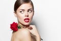 Attractive woman red lips Bare shoulders Rose charm look towards the model Royalty Free Stock Photo