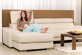 Attractive woman relax living room leather sofa Royalty Free Stock Photo