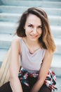 Attractive woman relaxing on the steps after longboard riding Royalty Free Stock Photo