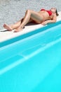 Attractive woman relexing on the swimming pool Royalty Free Stock Photo