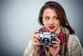 Attractive woman with a retro camera Royalty Free Stock Photo