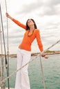 Attractive woman sailing on luxury yacht