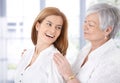 Attractive woman and senior mother laughing Royalty Free Stock Photo