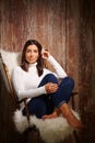 Attractive woman sitting in armchair Royalty Free Stock Photo