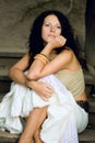 Attractive woman sitting on wooden stairs