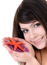 Attractive woman and starfish. Spa . Royalty Free Stock Photo