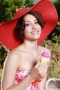 Attractive woman with strawhat and sweets Royalty Free Stock Photo