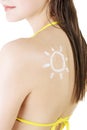 Attractive woman with sun-shaped sun cream on body. Royalty Free Stock Photo