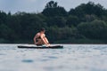 attractive woman in swimwear on supboard