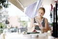 Attractive woman taking picture of a pastry on her