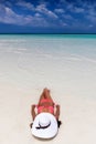 Attractive woman is taking a sunbath on a beach Royalty Free Stock Photo