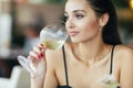 Attractive woman tasting white wine Royalty Free Stock Photo