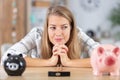 attractive woman thinking to break piggy bank Royalty Free Stock Photo