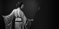 Attractive woman in traditional Japanese kimono with katana  japanese sword Royalty Free Stock Photo