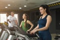 Attractive woman on treadmill in fitness club
