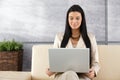 Attractive woman using laptop smiling Royalty Free Stock Photo