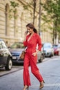 Attractive woman using smartphone at sidewalking in the city Royalty Free Stock Photo