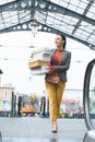 attractive woman walking with shopping boxes