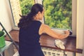 Attractive Woman Washing the Window. Cleaning Company worker working. Young woman washing window, close up. Cute girl with Royalty Free Stock Photo