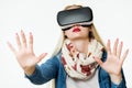 Attractive woman wearing virtual reality goggles. VR headset. Virtual reality concept on white Royalty Free Stock Photo