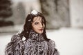 Attractive woman in white and gray fur coat Royalty Free Stock Photo