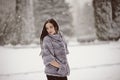 Attractive woman in white and gray fur coat Royalty Free Stock Photo