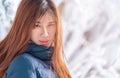 attractive woman with winter fashion clothing with beautiful skin face in snow skii resort, closed up portrait