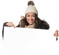 Attractive woman in winter fashion holding a sign