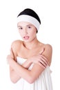 Attractive woman wrapped in white towel wth headband. Royalty Free Stock Photo