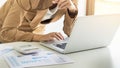 Attractive women in casual business sitting at a table working o