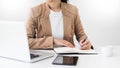 Attractive women in casual business sitting at a table working o