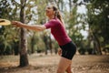 Attractive Women Enjoying Outdoor Frisbee Game in the Park on a Sunny Day Royalty Free Stock Photo