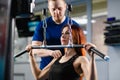 Woman train hands in gym with trainer Royalty Free Stock Photo